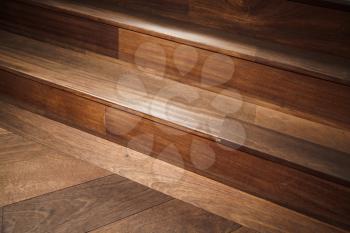 Abstract empty interior fragment, natural wooden stairs. Closeup photo with selective focus