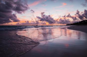Colorful coastal landscape. Atlantic Ocean coast at sunset. Bavaro beach, Dominican Republic