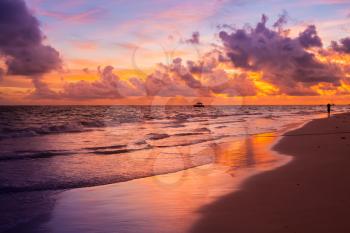 Colorful sunrise over Atlantic Ocean. Bavaro beach, Hispaniola Island. Dominican Republic, coastal landscape