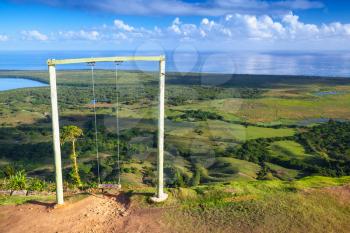 Empty swings on the top of Montana Redonda. Dominican Republic, natural landscape photo