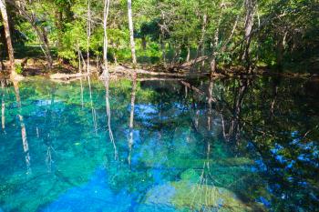 Still blue lake in forest, landscape of Dominican Republic