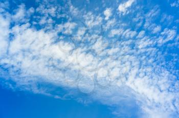 Blue sky with white altocumulus clouds at daytime, background photo texture
