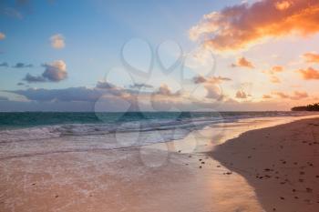 Orange sunrise over Atlantic Ocean coast, Bavaro beach, Hispaniola Island. Dominican Republic, coastal landscape
