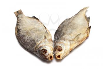 Two dried fishes isolated on white background