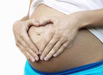 Pregnant woman with tan belly
