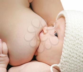 Newborn baby breast feeding breast