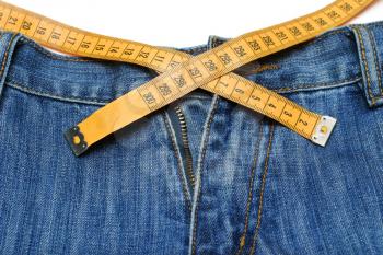 Jeans and tape measure isolated