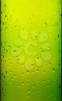 Green bottle glass with drops