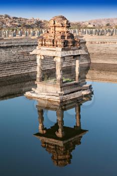Ruined pond with water, Hampi, India