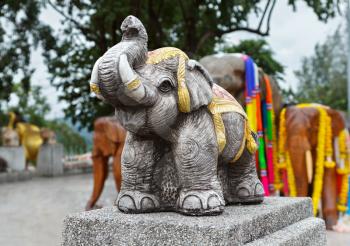 Group of elephant statues decorated with flowers