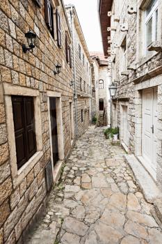 Typical narrow cobblestone street in european city