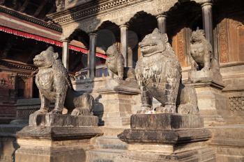 KATMANDU, NEPAL - APRIL 16: Stone statues near the temple on Durbar square on April 16, 2012, Katmandu, Nepal.