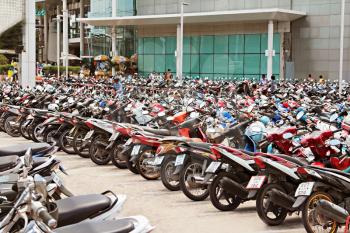 PHUKET, THAILAND - NOVEMBER 20: Many motorbikikes at the parking near big store on November, 20, 2010, Phuket, Thailand. Motorbike is a most popular transport in Thailand.