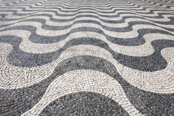Waves of tiled floor in portuguese traditional style, Rossio square, Lisbon