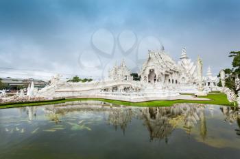 Wat Rong Khun (White Temple) is a contemporary art exhibit in the style of a Buddhist temple in Chiang Rai, Thailand 