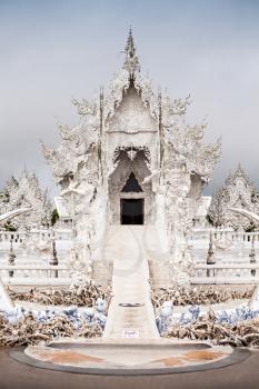 Wat Rong Khun (White Temple) is a contemporary art exhibit in the style of a Buddhist temple in Chiang Rai, Thailand 