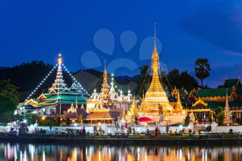 Lake with Wat Chong Klang and Wat Chong Kham temples on sunset, Mae Hong Son, Thailand