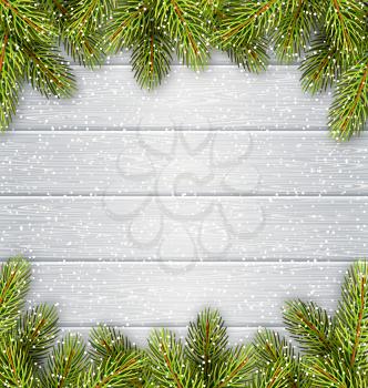 Christmas Tree Pine Branches Like Frame in Snowfall on White Wooden Background