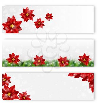 Three Christmas leaflets with flowers of poinsettia in snowfall