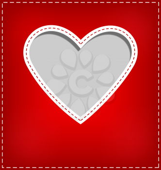 Heart cutout in red card on grey background