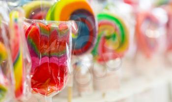 Colorful covered lollipops in a candy shop