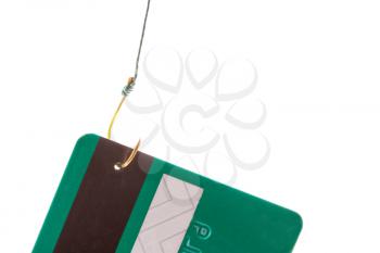 Closeup of a credit card caught on a fishing hook