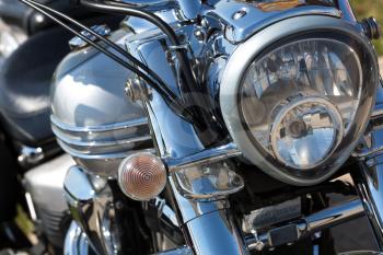 Closeup of chromed motorcycle headlight