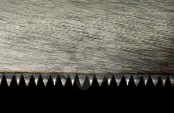 Closeup of saw blade isolated on black