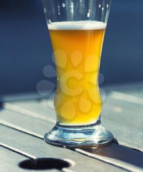 Glass of beer on an outdoor patio
