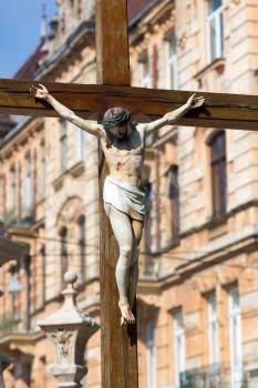 Wooden monument of Jesus crucifixion in european town