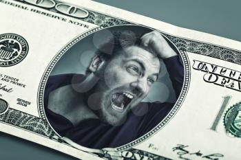Frustrated angry man on the dollar banknote crying