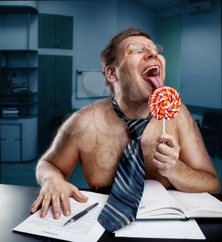 Crazy office worker licking lollipop