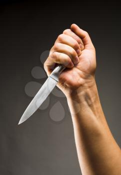 Close-up of hand with knife