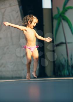 Little girl dancing on beach disco