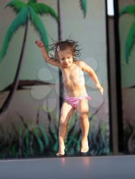Little girl dancing on beach disco