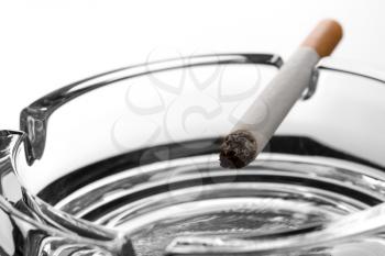 Closeup of cigarette on ashtray