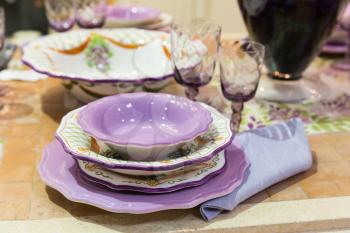 Served with a kitchen tools on the table with glases and pink plates
