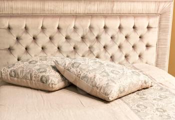 Luxury bed with pillows closeup