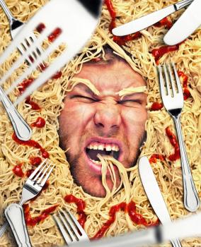 Man eating pasta, dinner time