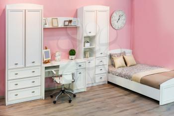 Children bedroom in pastel white and pink colors