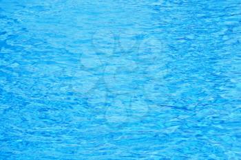Blue pool water ripples. Texture of background
