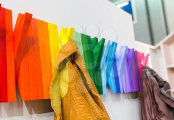 Multicolored wooden hanger with jackets