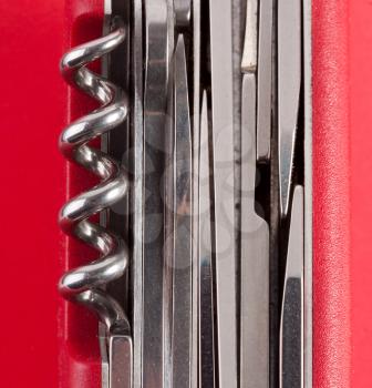 Red Swiss army knife. Background or texture
