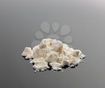 Pile of cocaine on grey background 