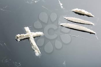 Cocaine cross and lines on grey background
