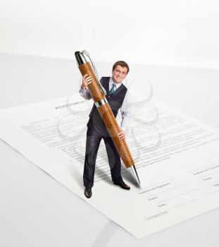 Man with a big pen is going to sign a document