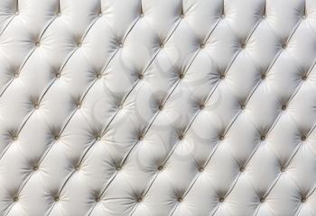 Buttoned white texture. Luxurious background