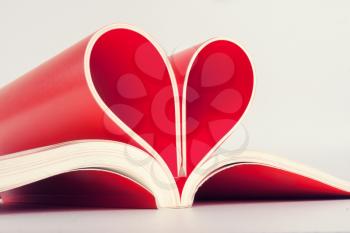 Close-up of book pages folded into a heart shape