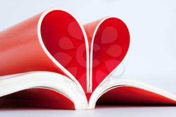 Close-up of book pages folded into a heart shape