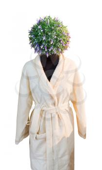 Human figure in a beige bathrobe with flower head 